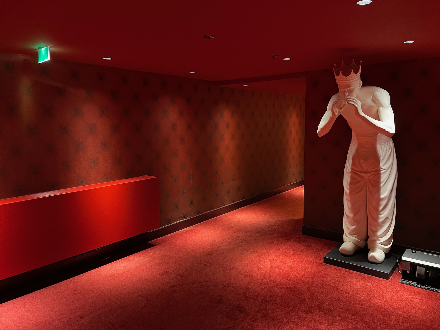 a statue of a man in a red room