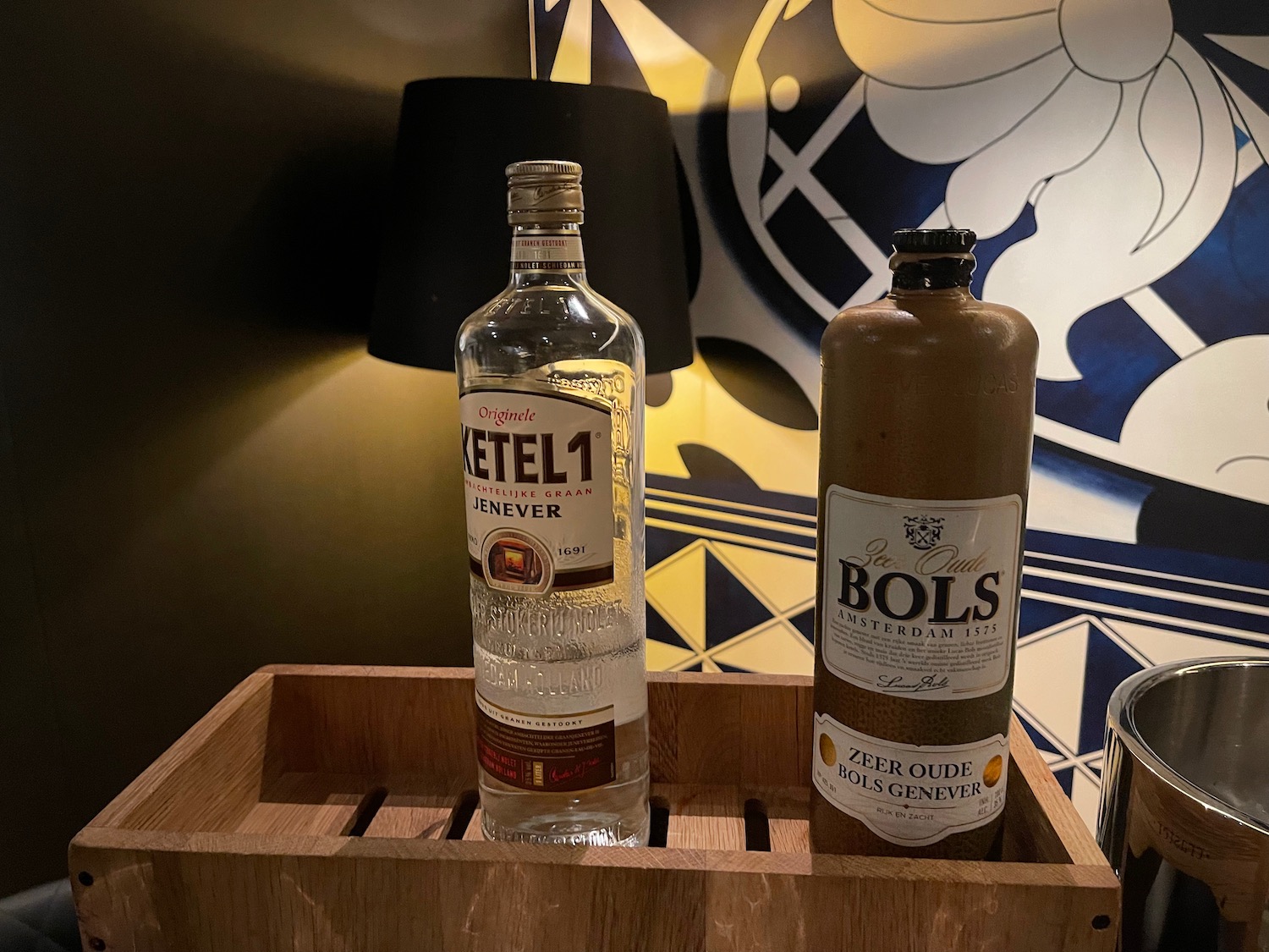 a bottle of alcohol on a wooden box