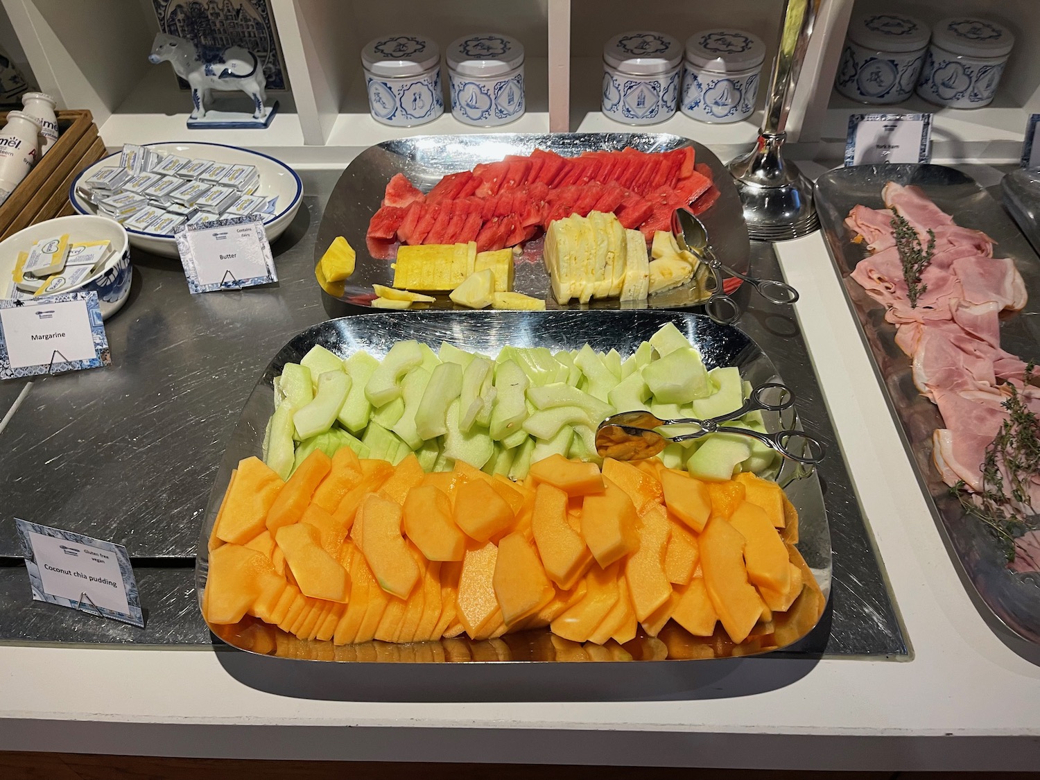 a trays of fruit on a counter