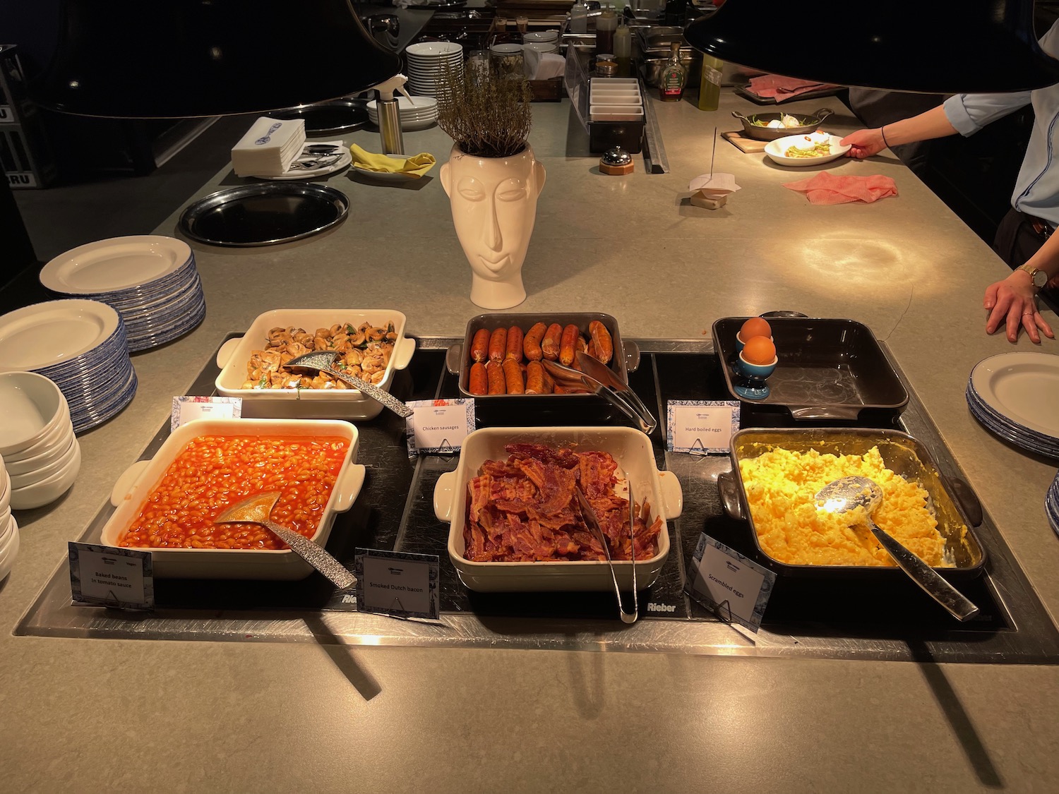 a buffet table with food in containers