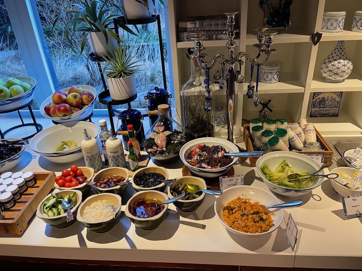 a table with bowls of food and other food items