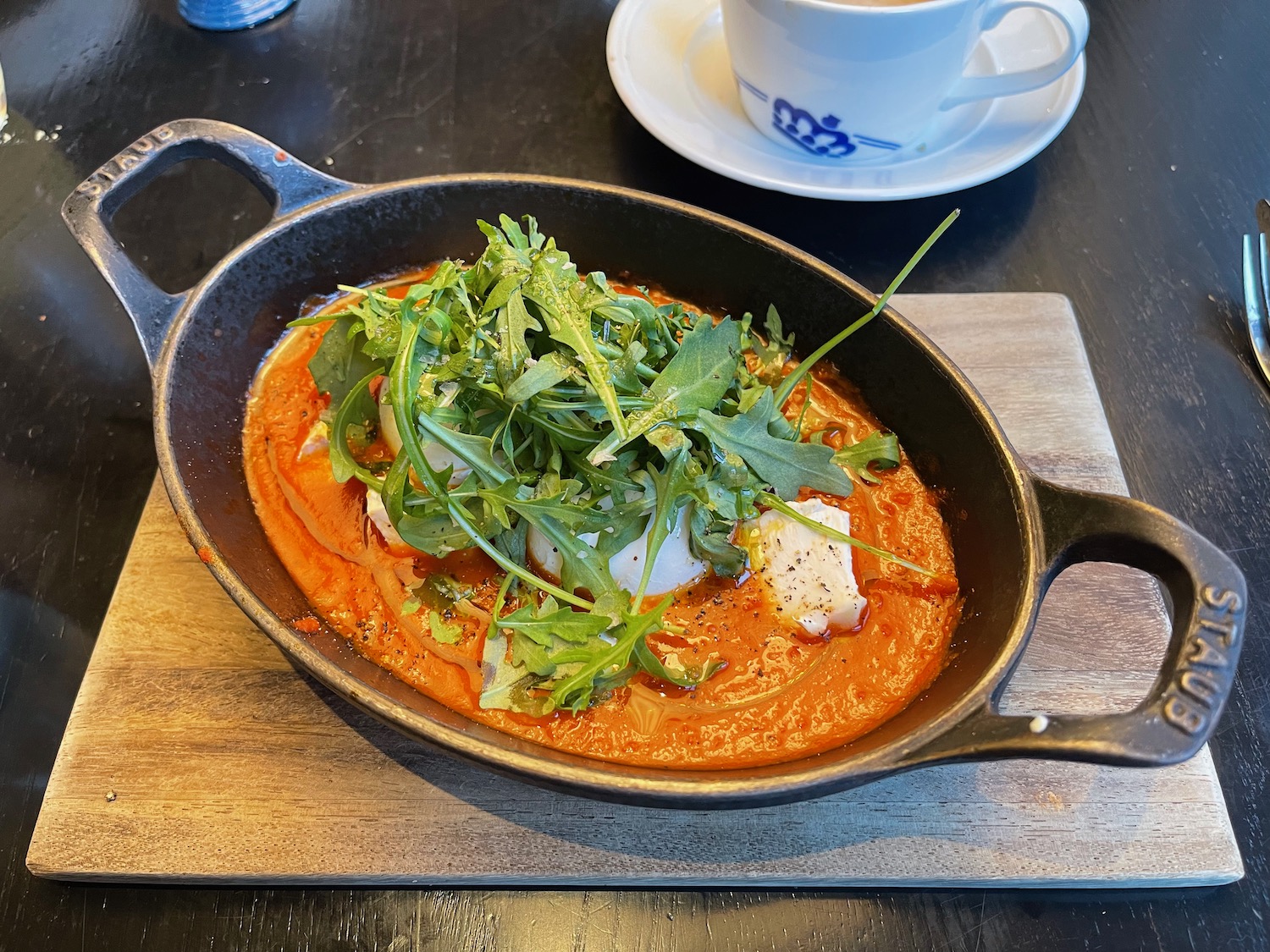 a bowl of food and a cup of coffee