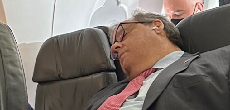 a man sleeping on an airplane