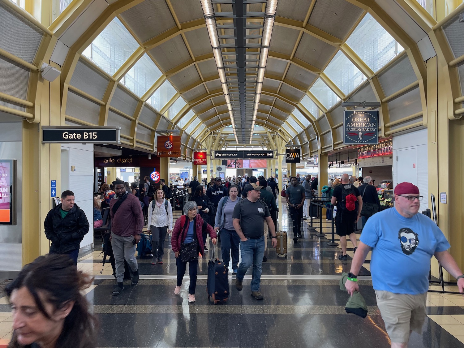 a group of people walking in a terminal