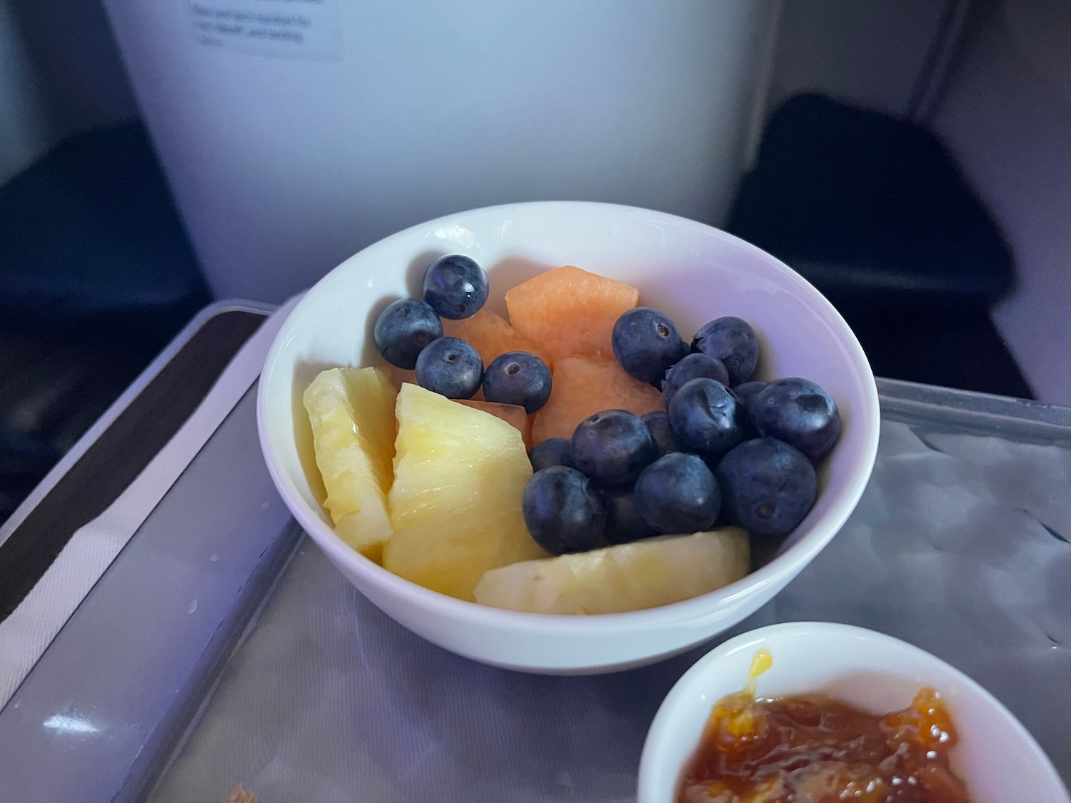 a bowl of fruit and jam