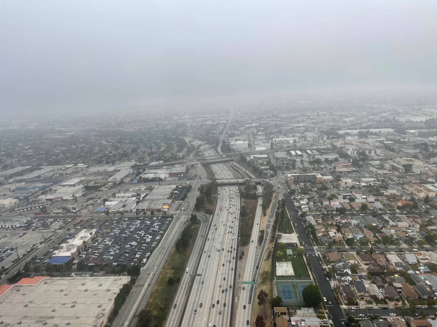 aerial view of a city with many roads and buildings