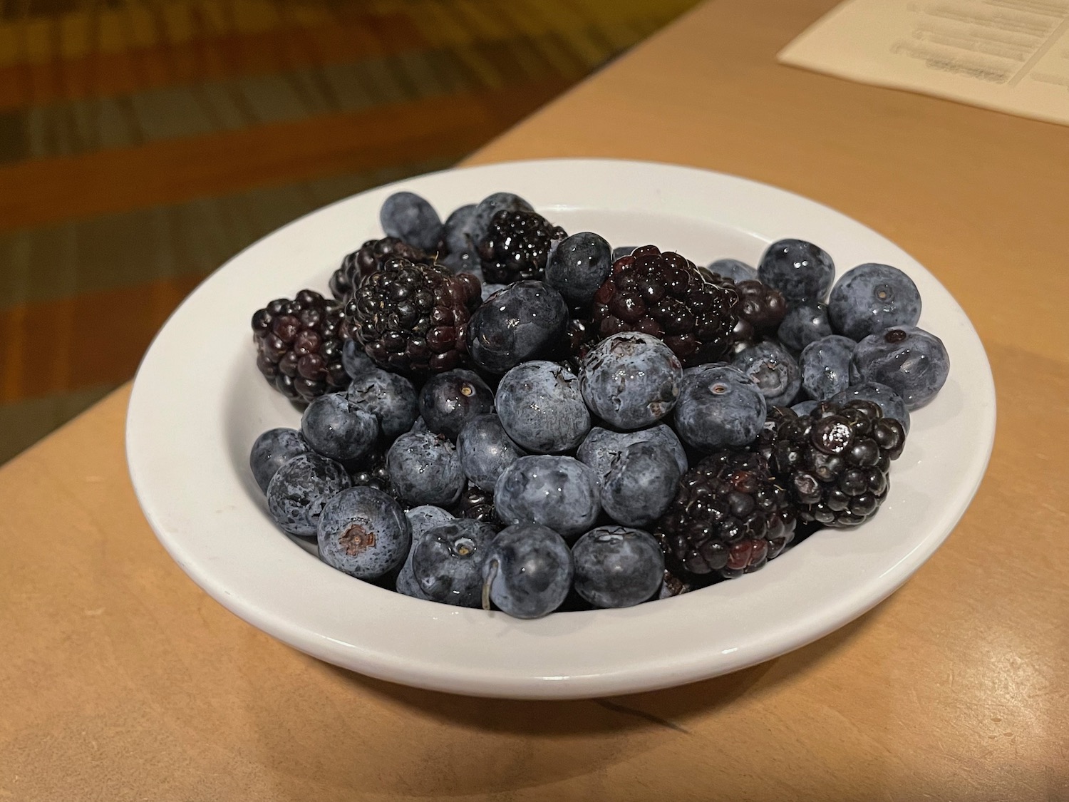 a bowl of blueberries and blackberries