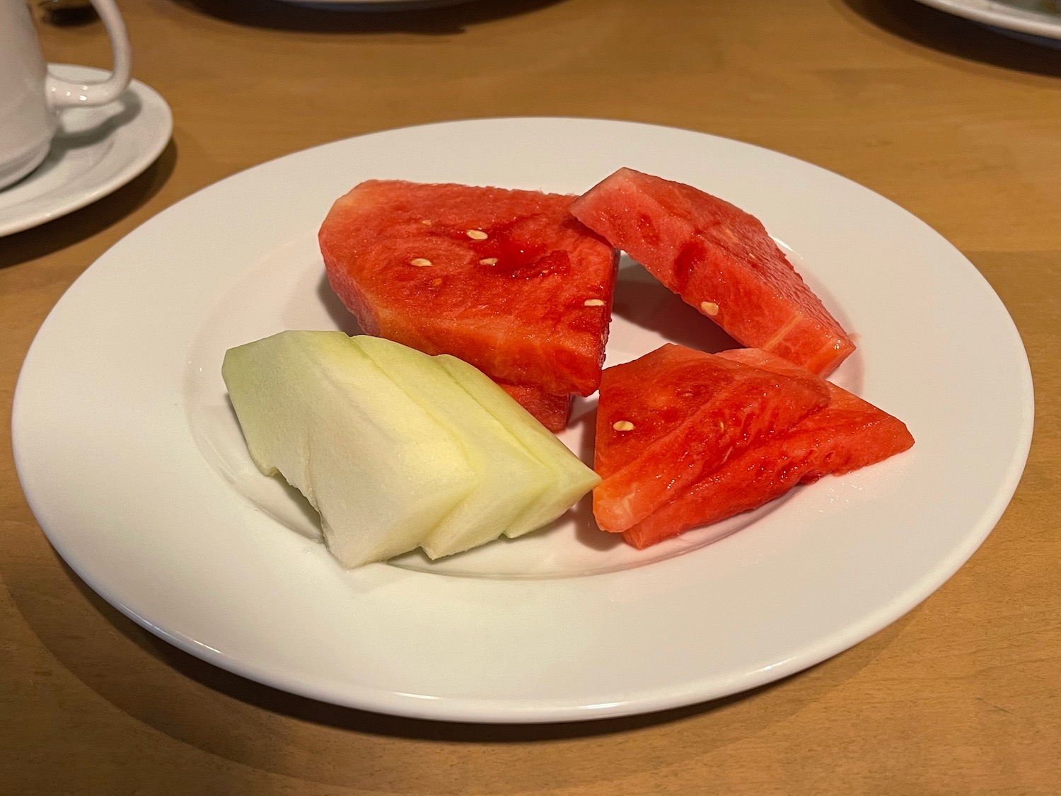 a plate of watermelon and melon