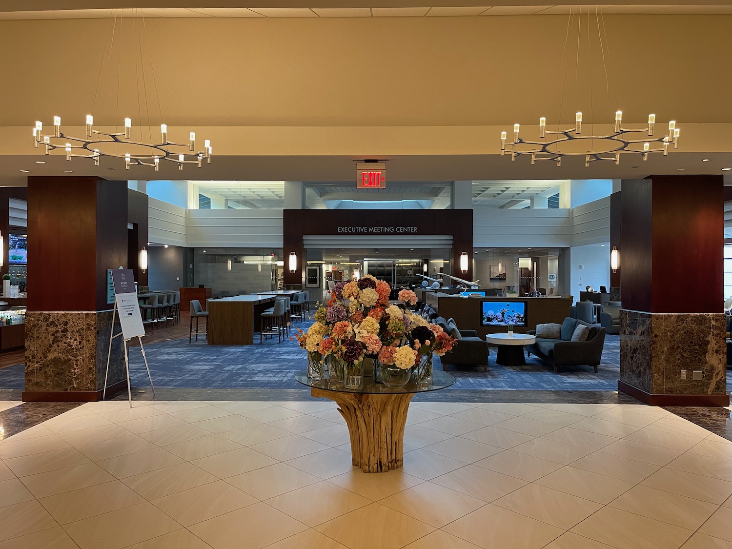 a large vase of flowers in a lobby