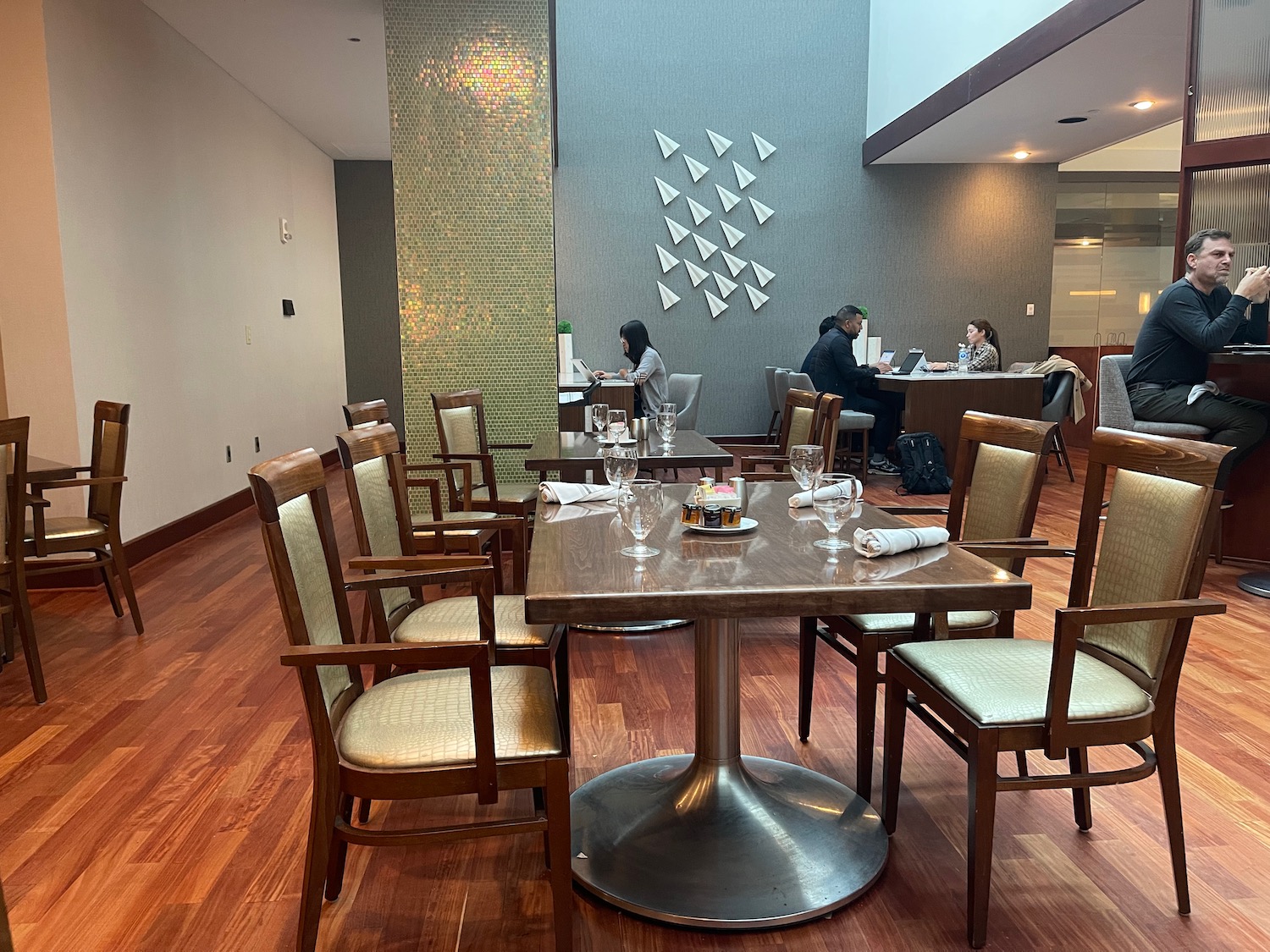 a group of people sitting at tables in a room