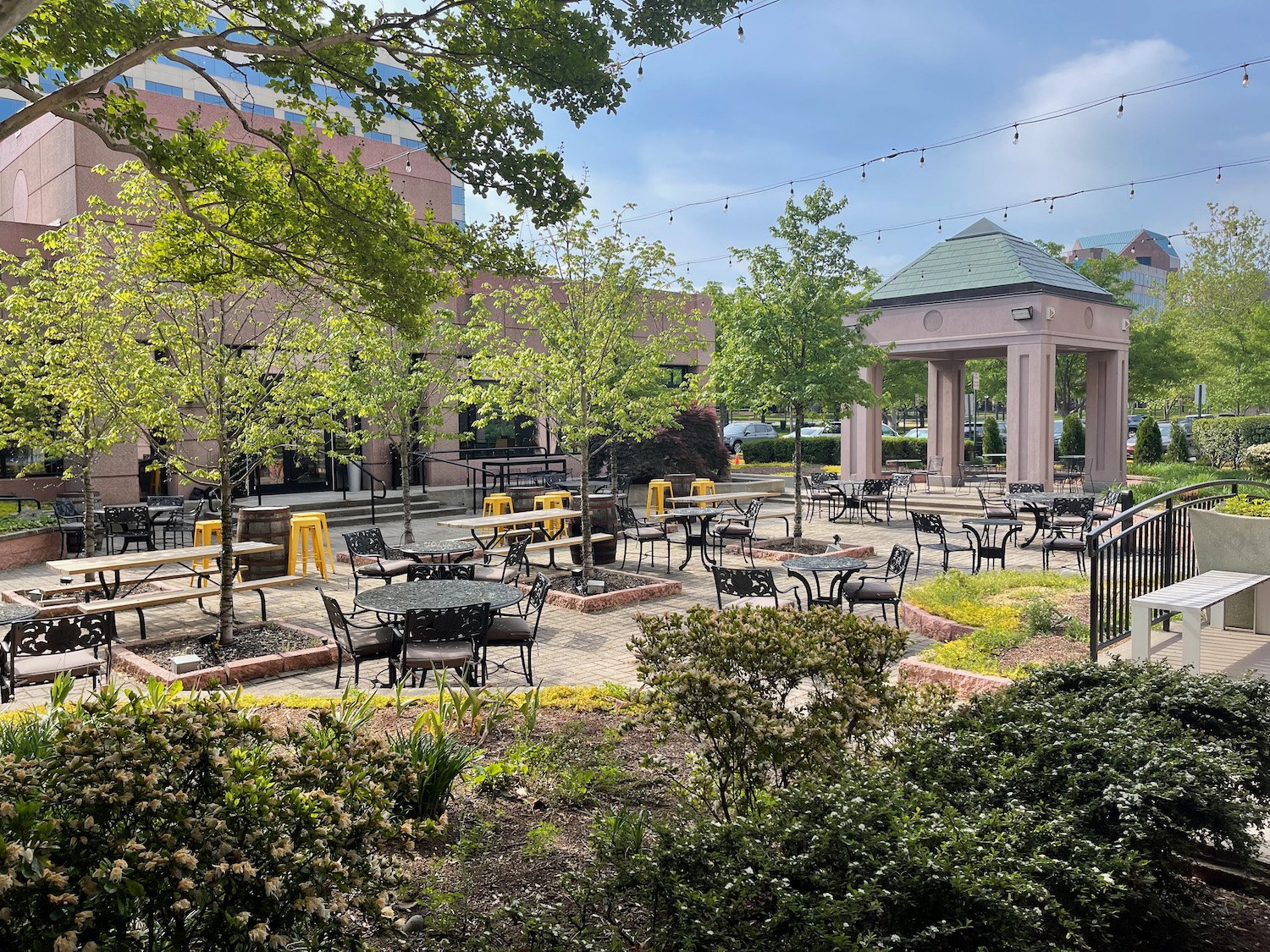 a group of tables and chairs in a park