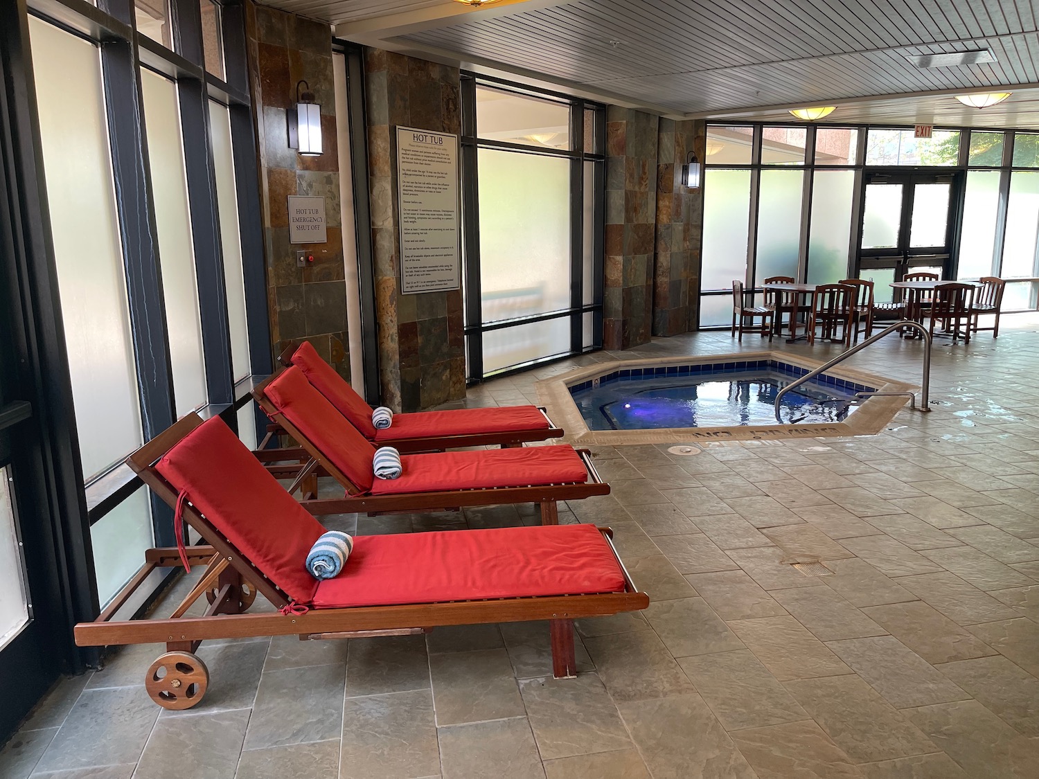 chairs in a room with a hot tub