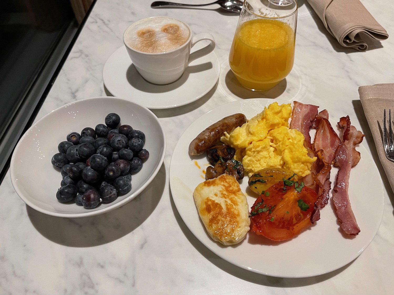 a plate of food and a drink on a table