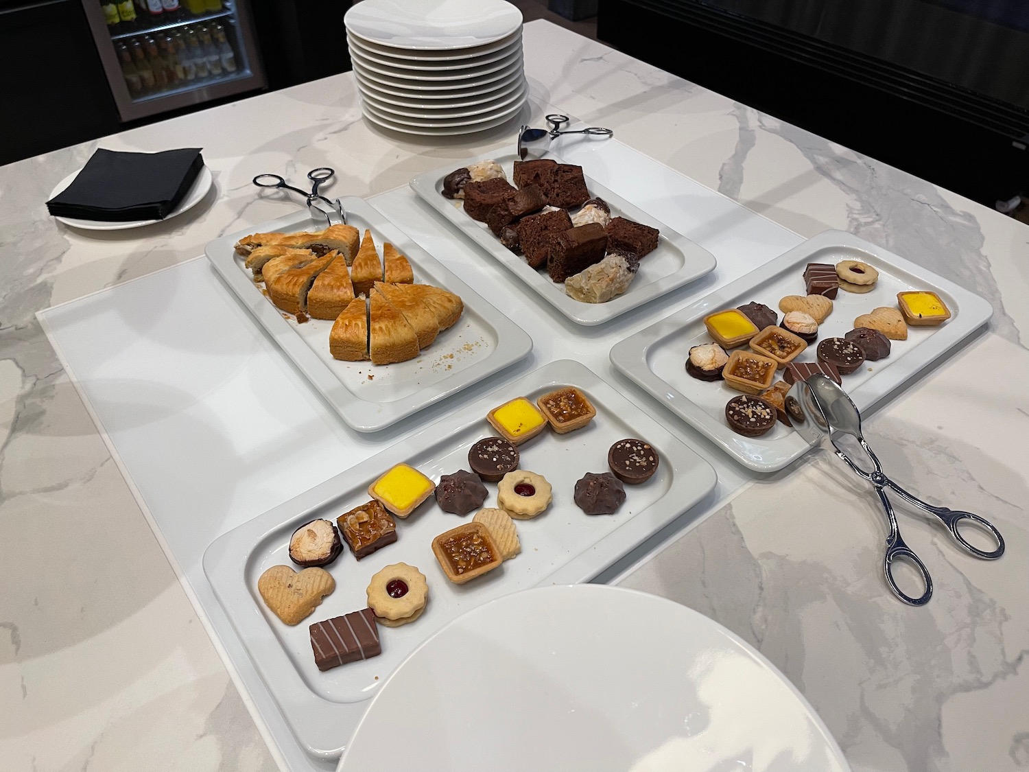 a group of plates of pastries on a table