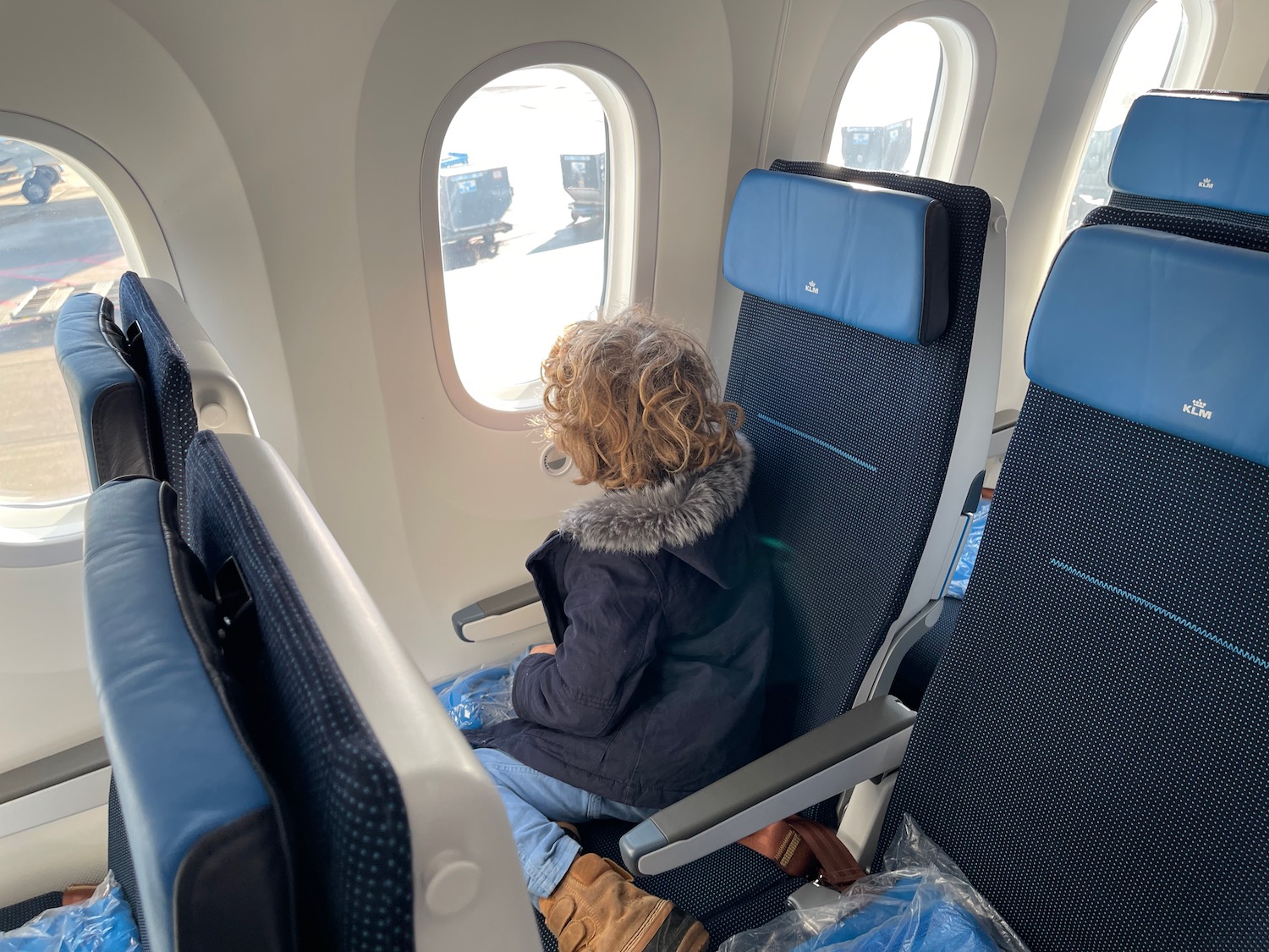 a woman sitting in an airplane