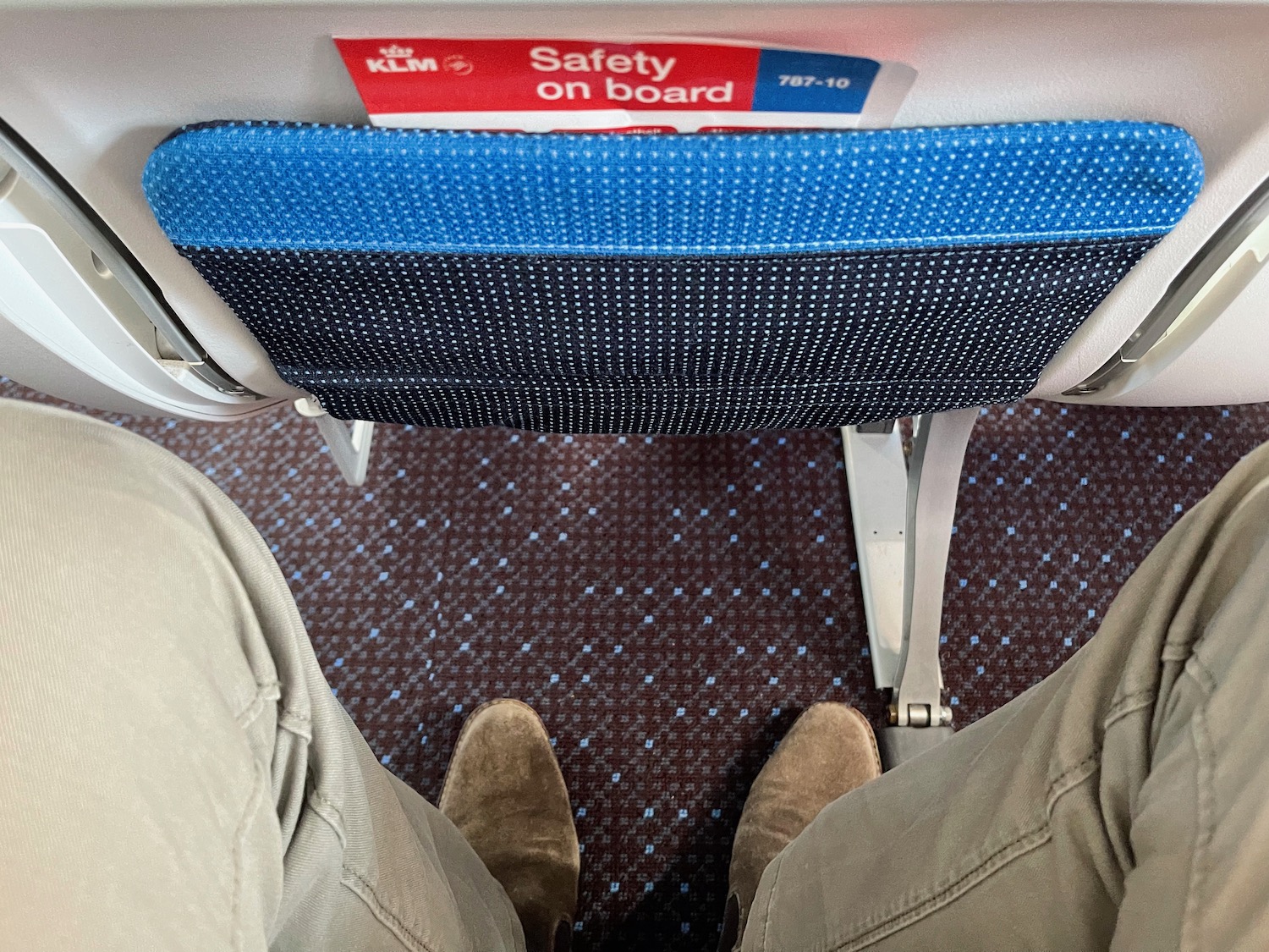 a seat with a blue and white seat and a blue and white seat with a red and white sign