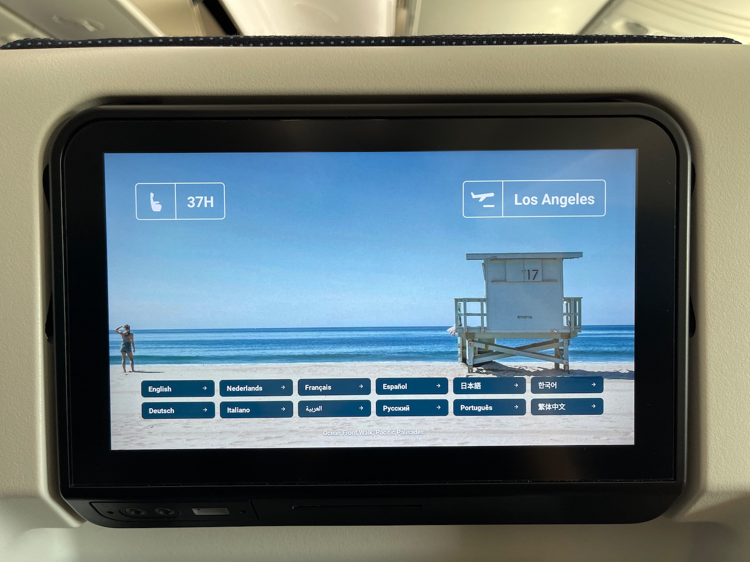 a screen with a picture of a beach and a lifeguard stand