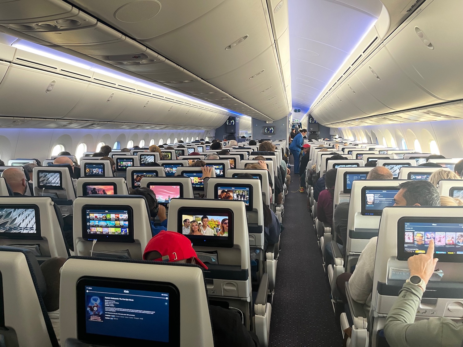 a group of people sitting in an airplane