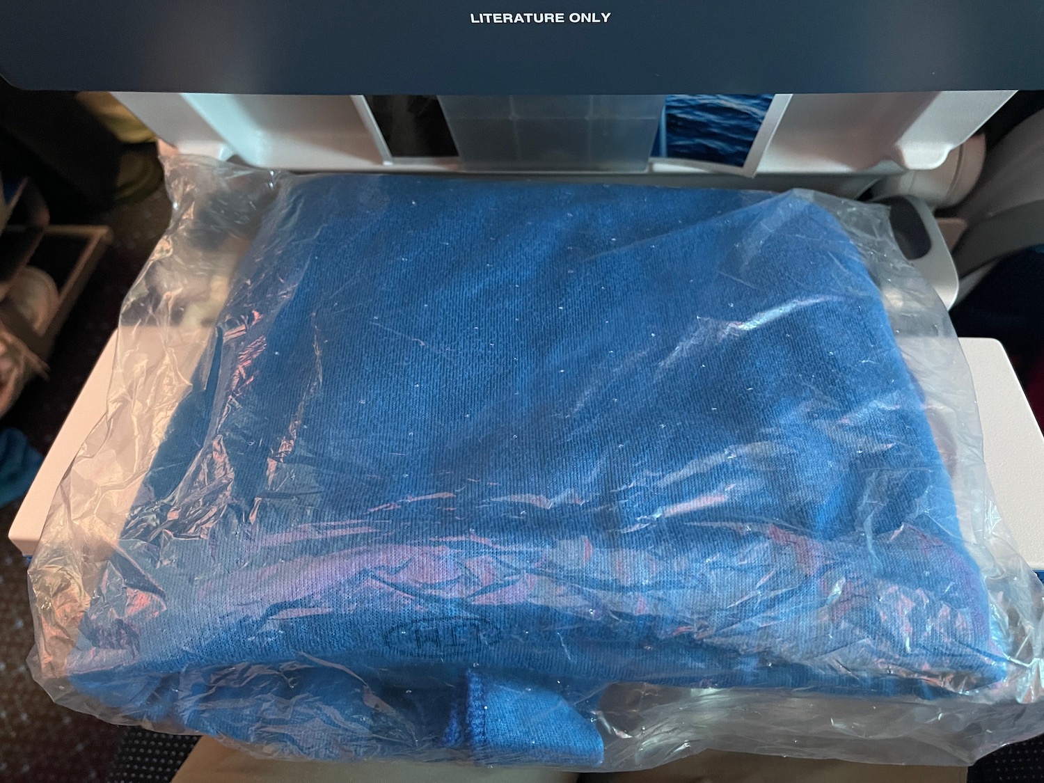 a blue blanket in a plastic bag