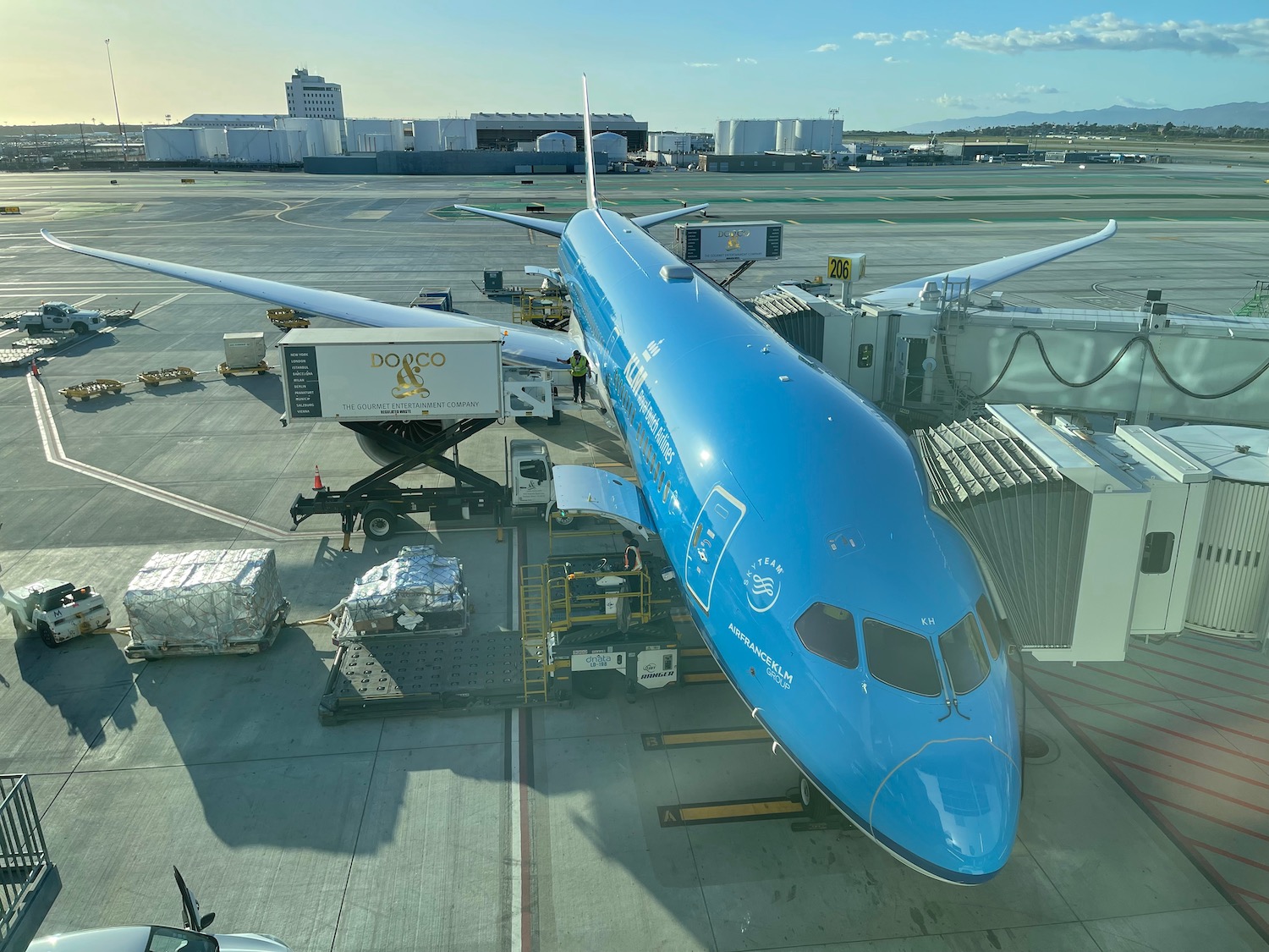 a blue airplane at an airport