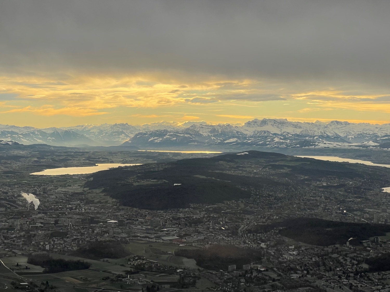 a landscape of a city and mountains