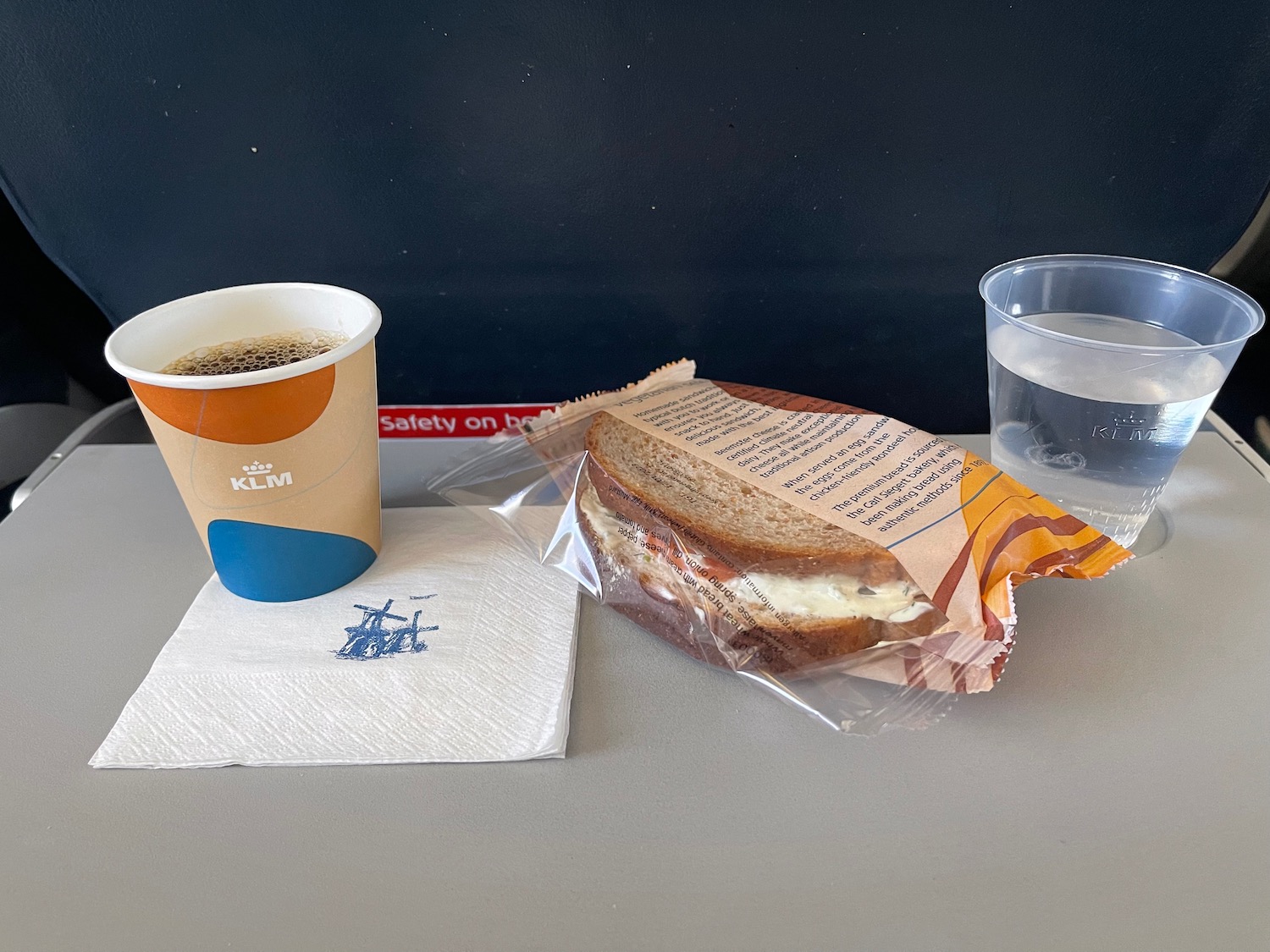 a sandwich and a cup of coffee