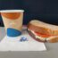 a sandwich and a cup of coffee