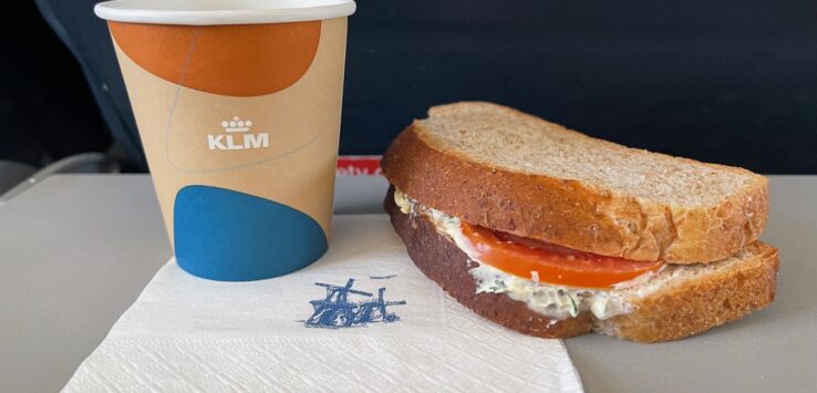 a sandwich and a cup of coffee