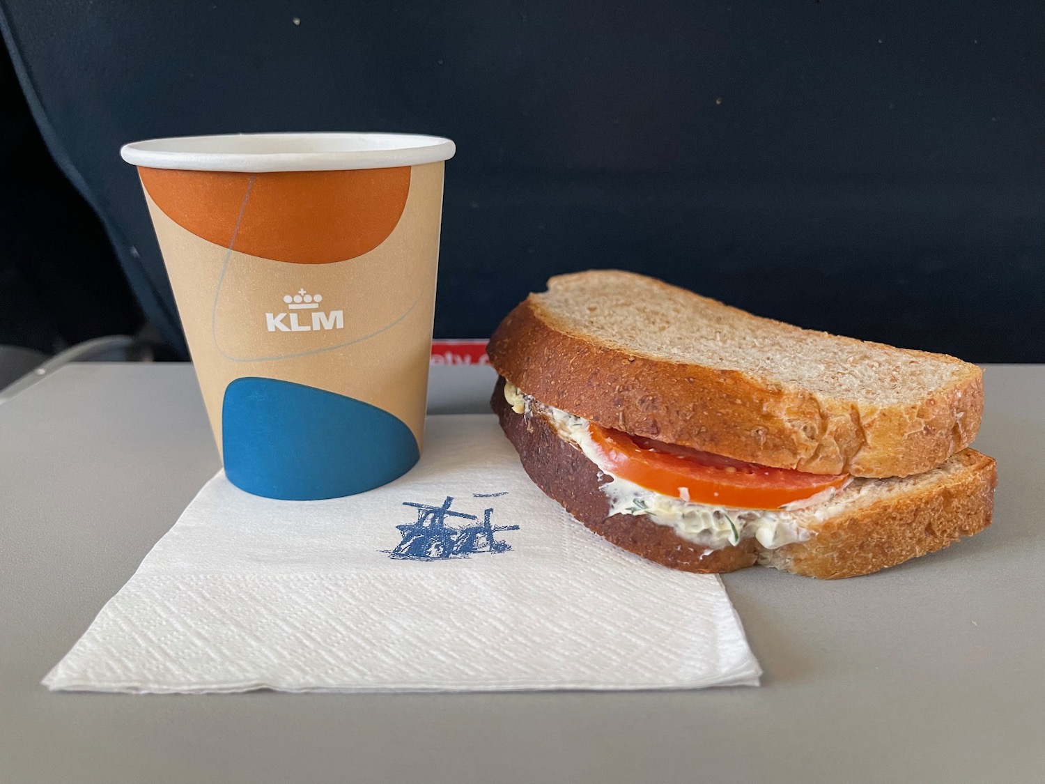 a sandwich and a cup of coffee