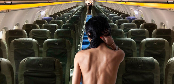 a woman sitting in an airplane
