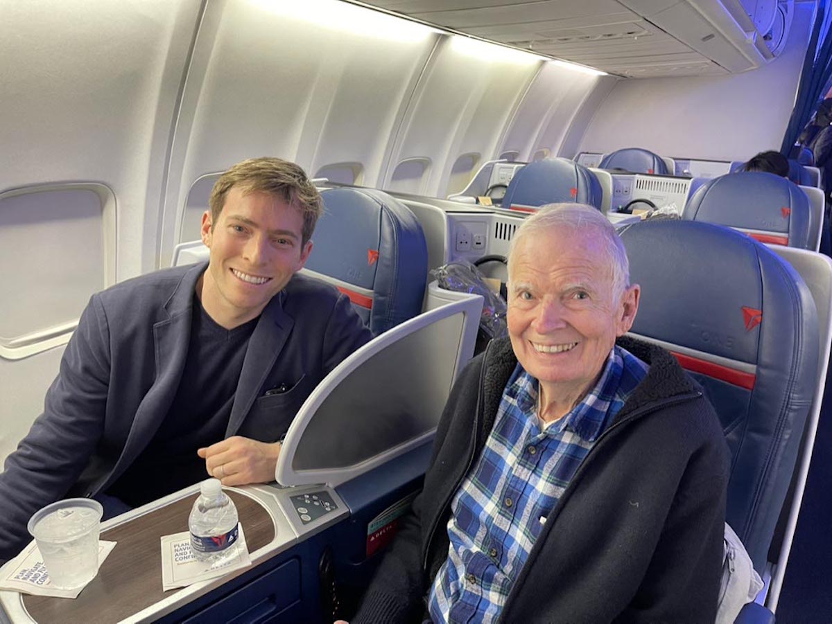 two people sitting in an airplane