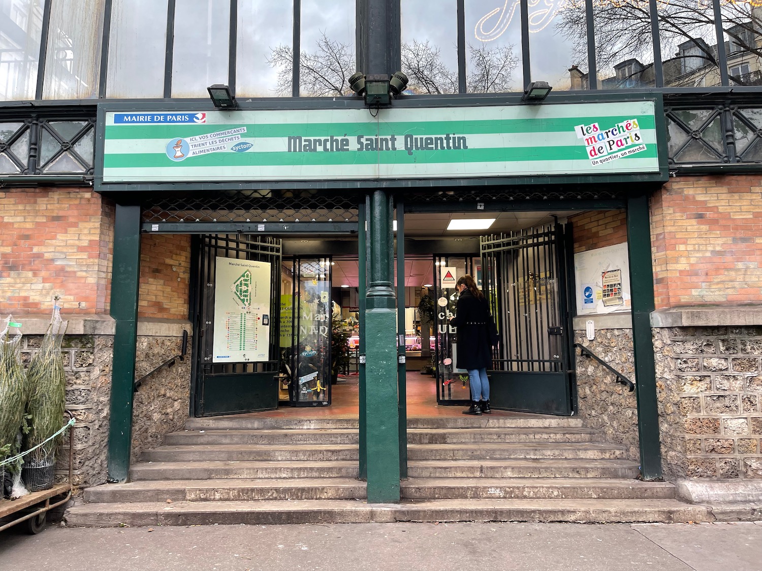 a woman standing in front of a store