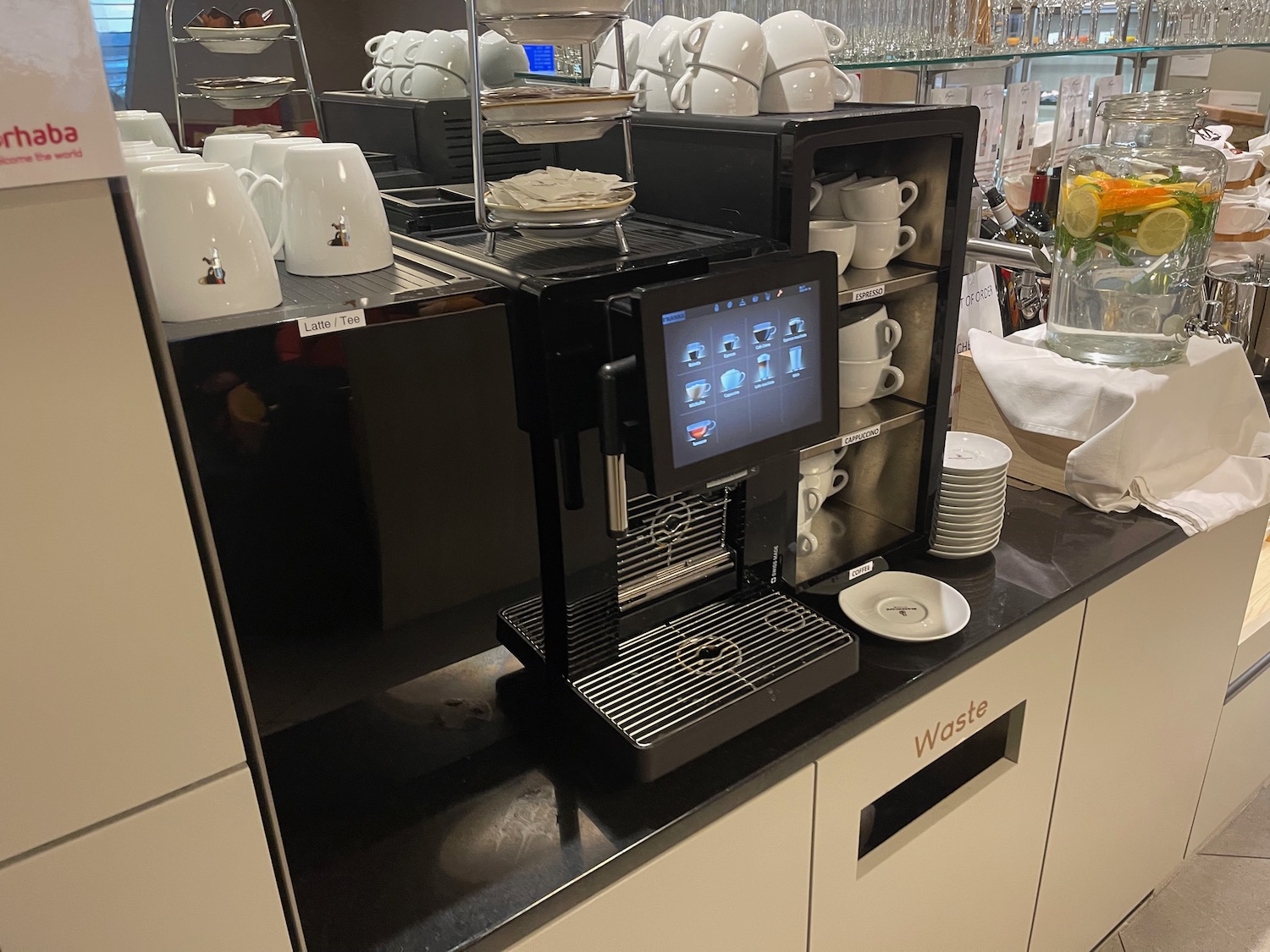 a machine with a screen and cups on it