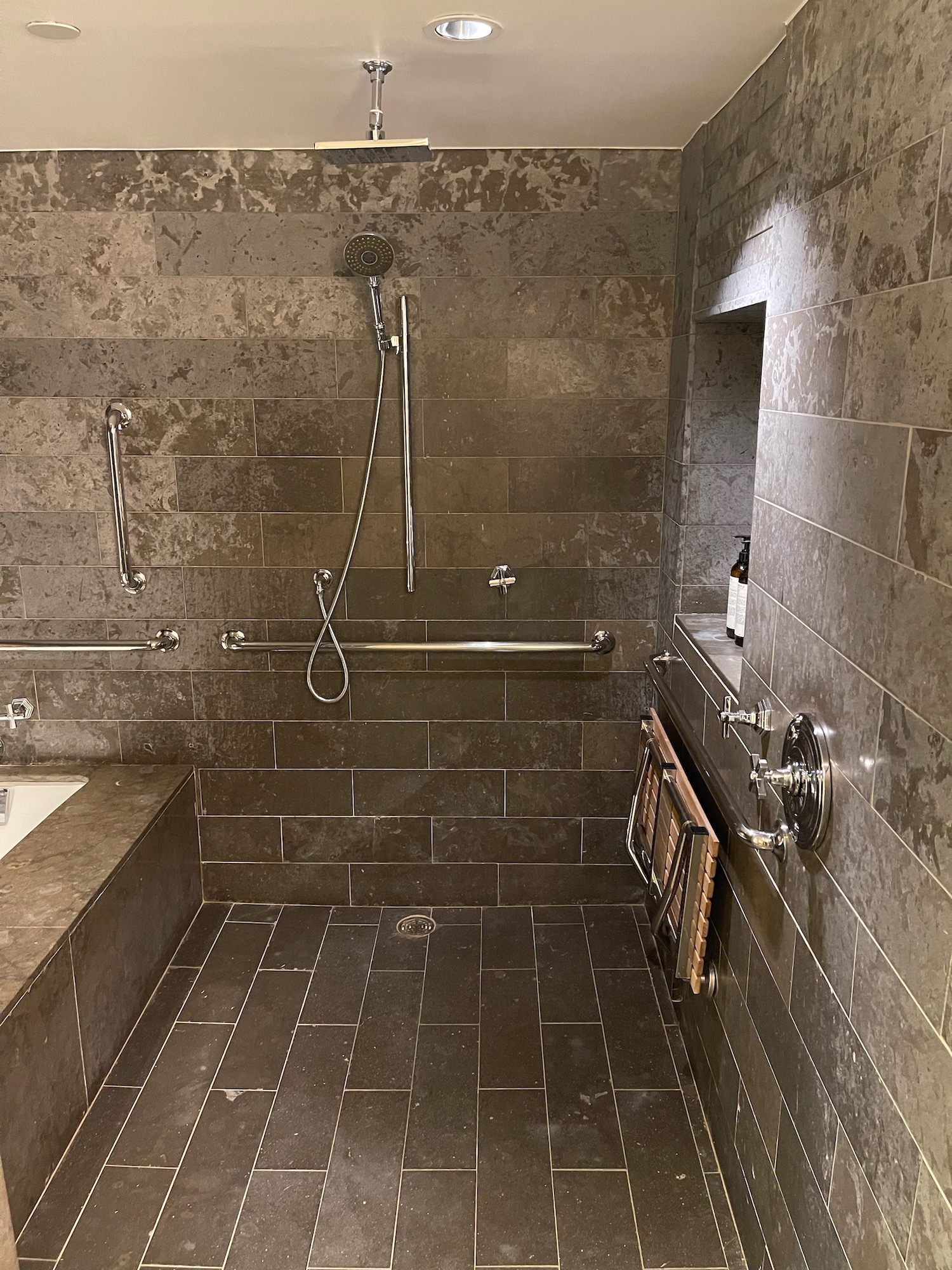 a bathroom with a shower and tub