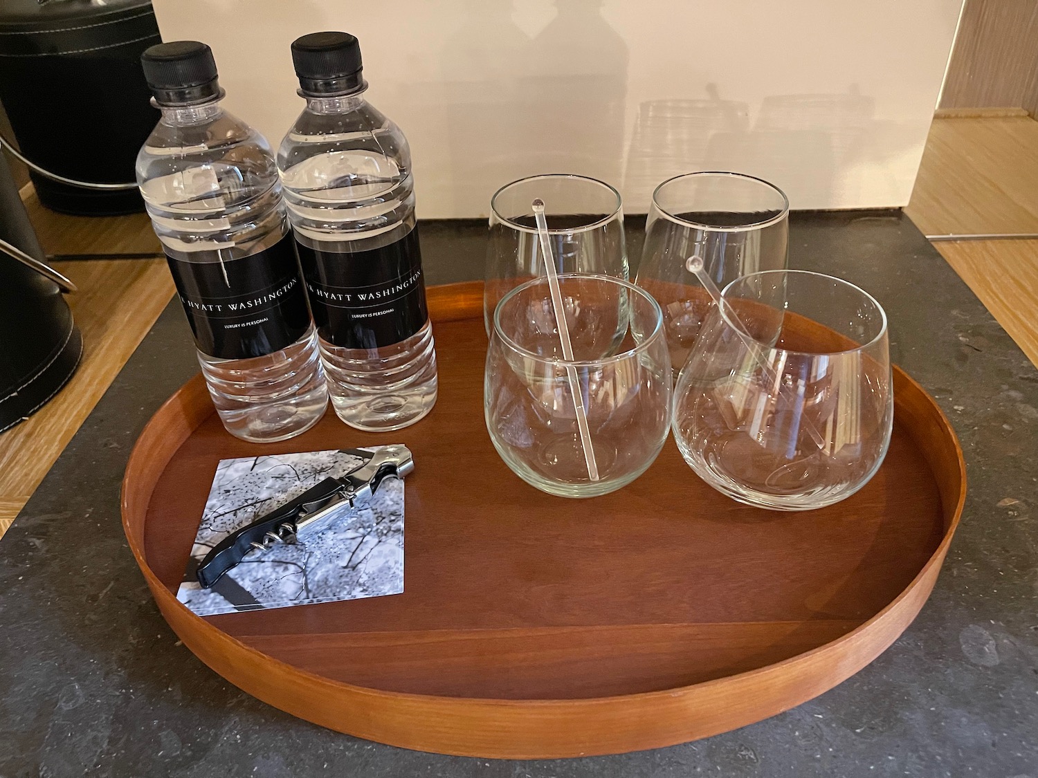 a tray with bottles and glasses on it
