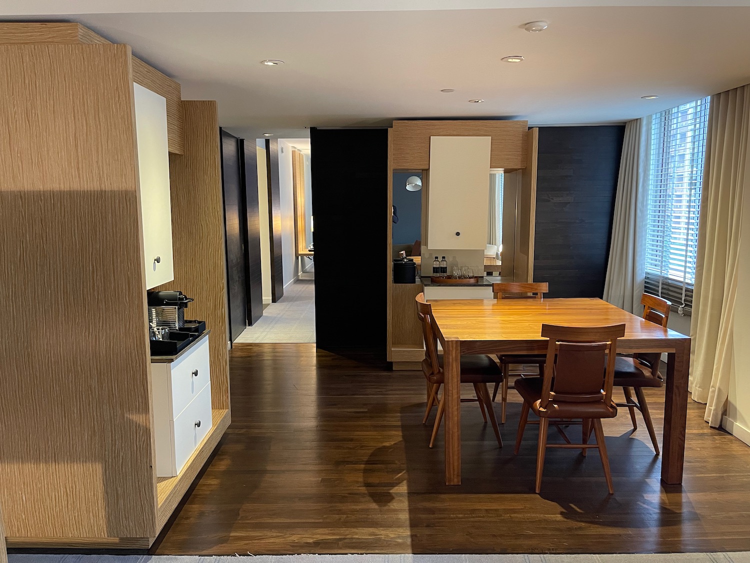 a dining table and chairs in a room