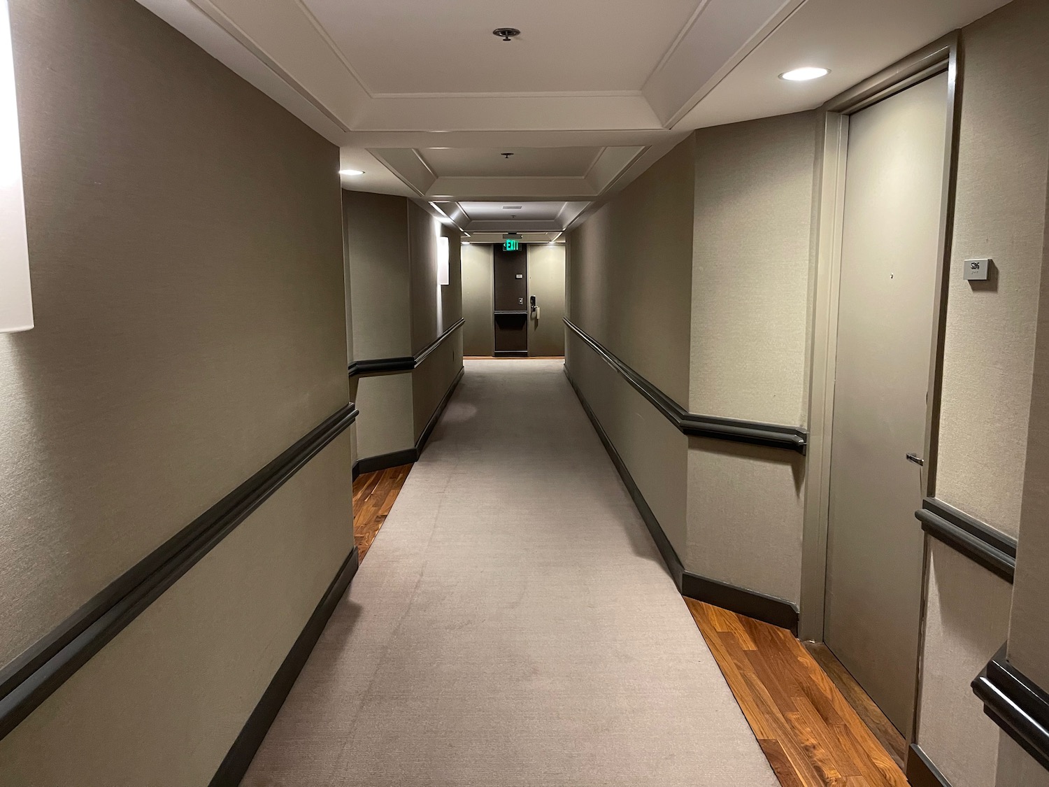 a hallway with a door and a door open