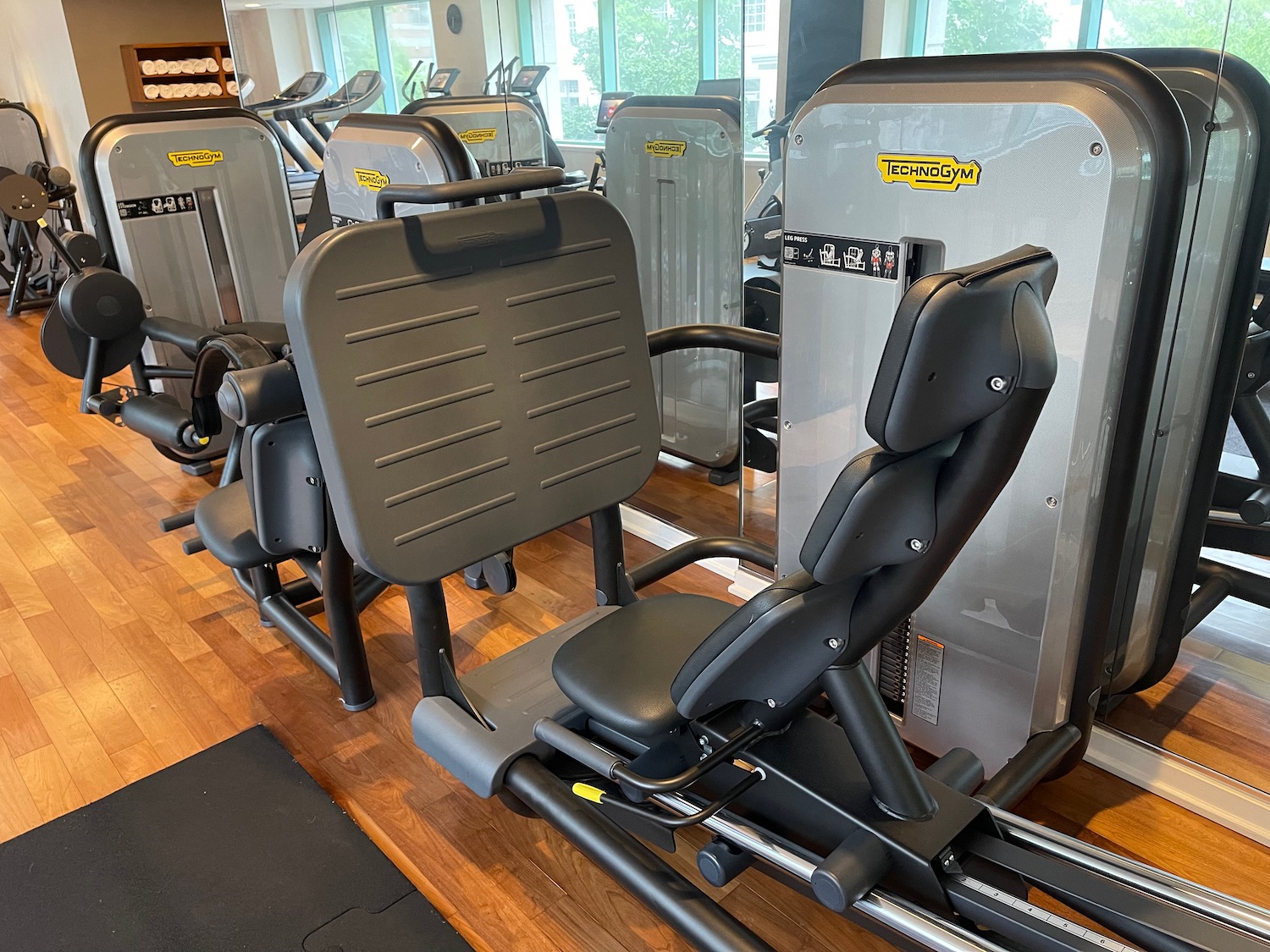 a group of exercise machines in a gym