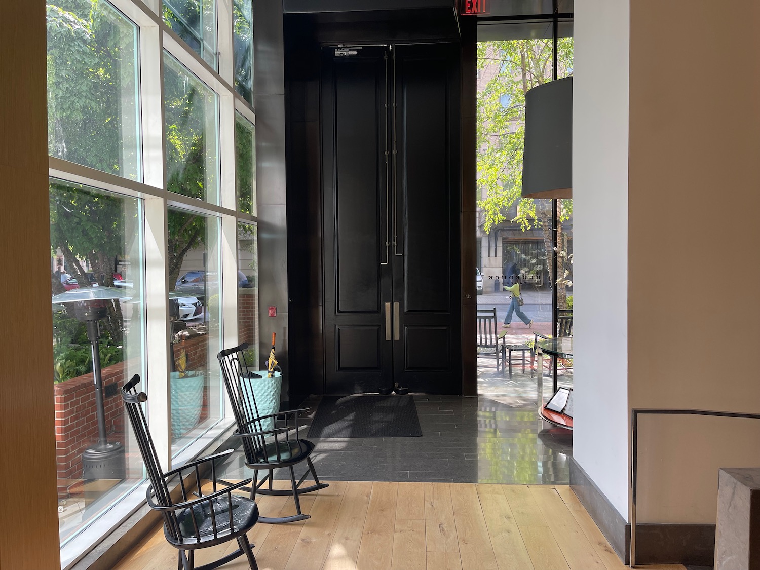 a black door with two chairs