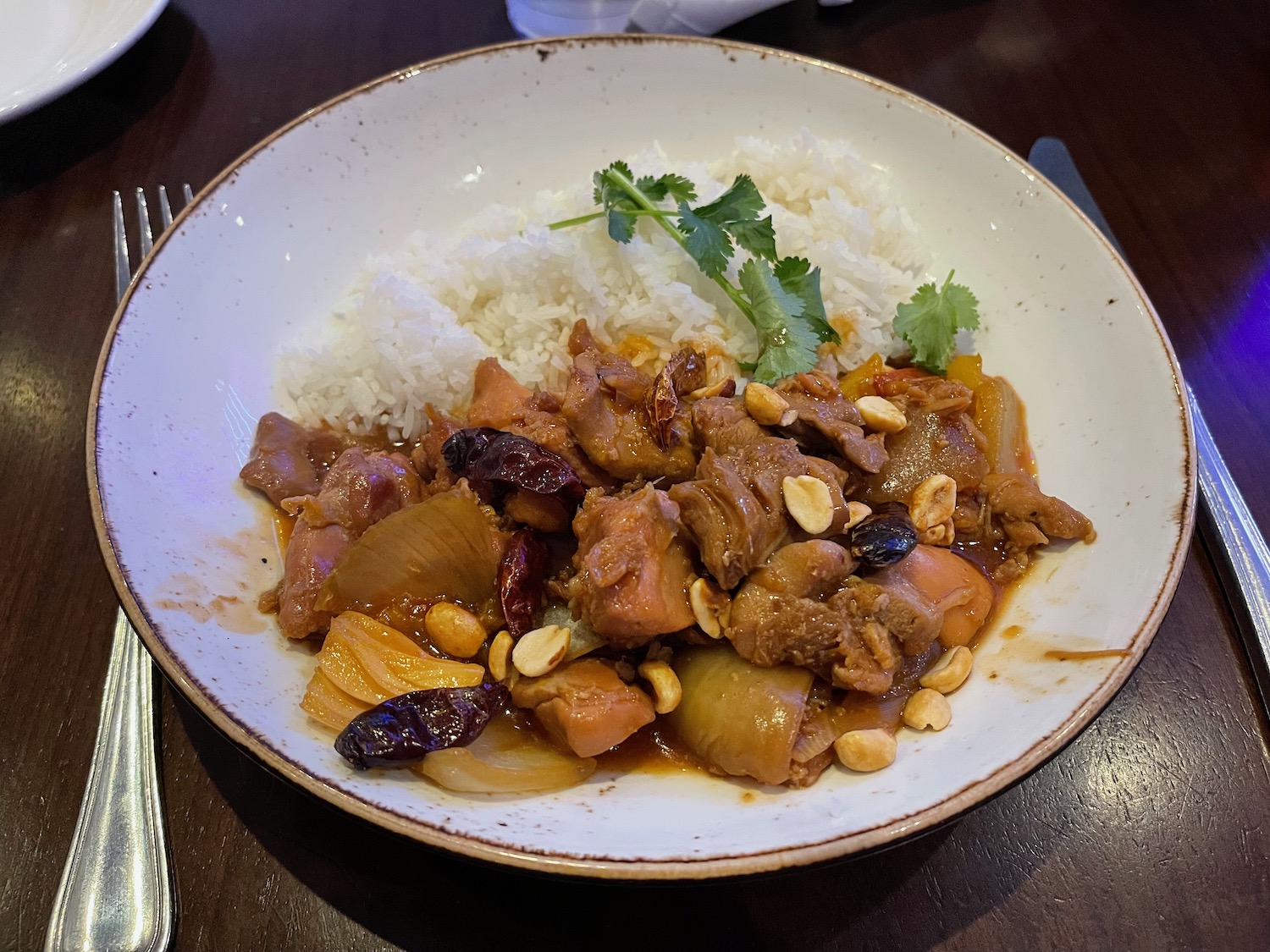 a plate of food with rice and meat