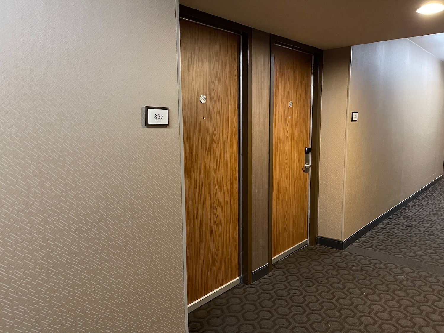 a row of doors in a hotel room