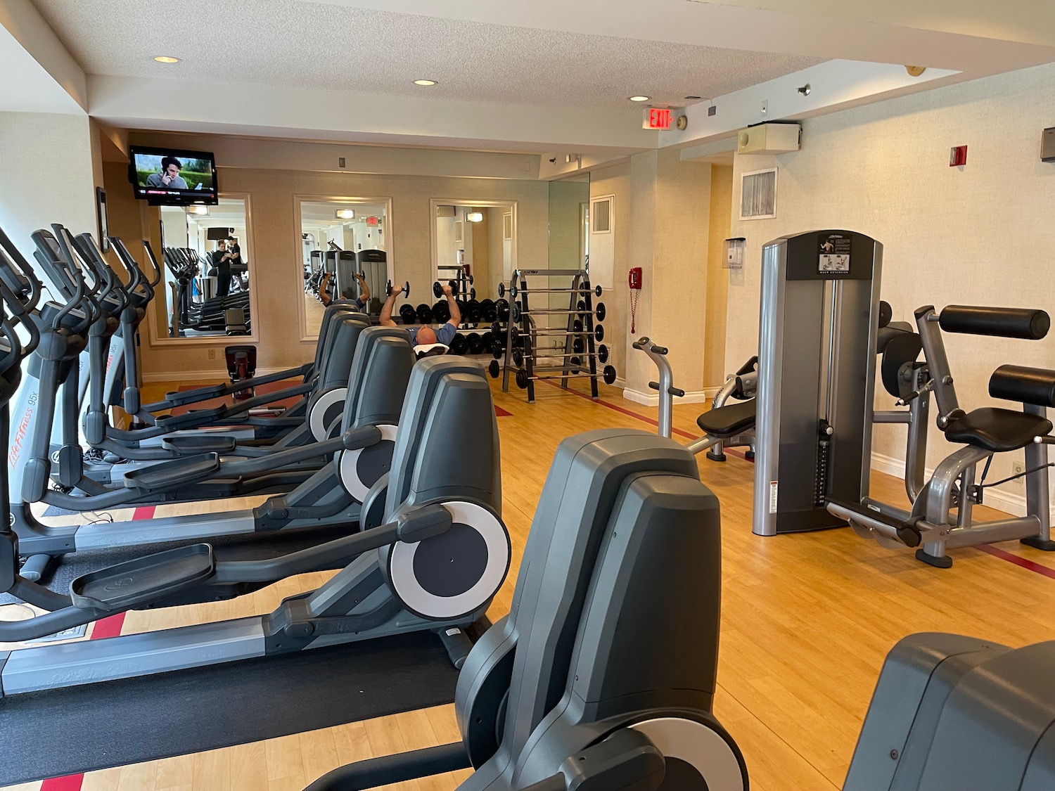 a large room with treadmills and exercise equipment