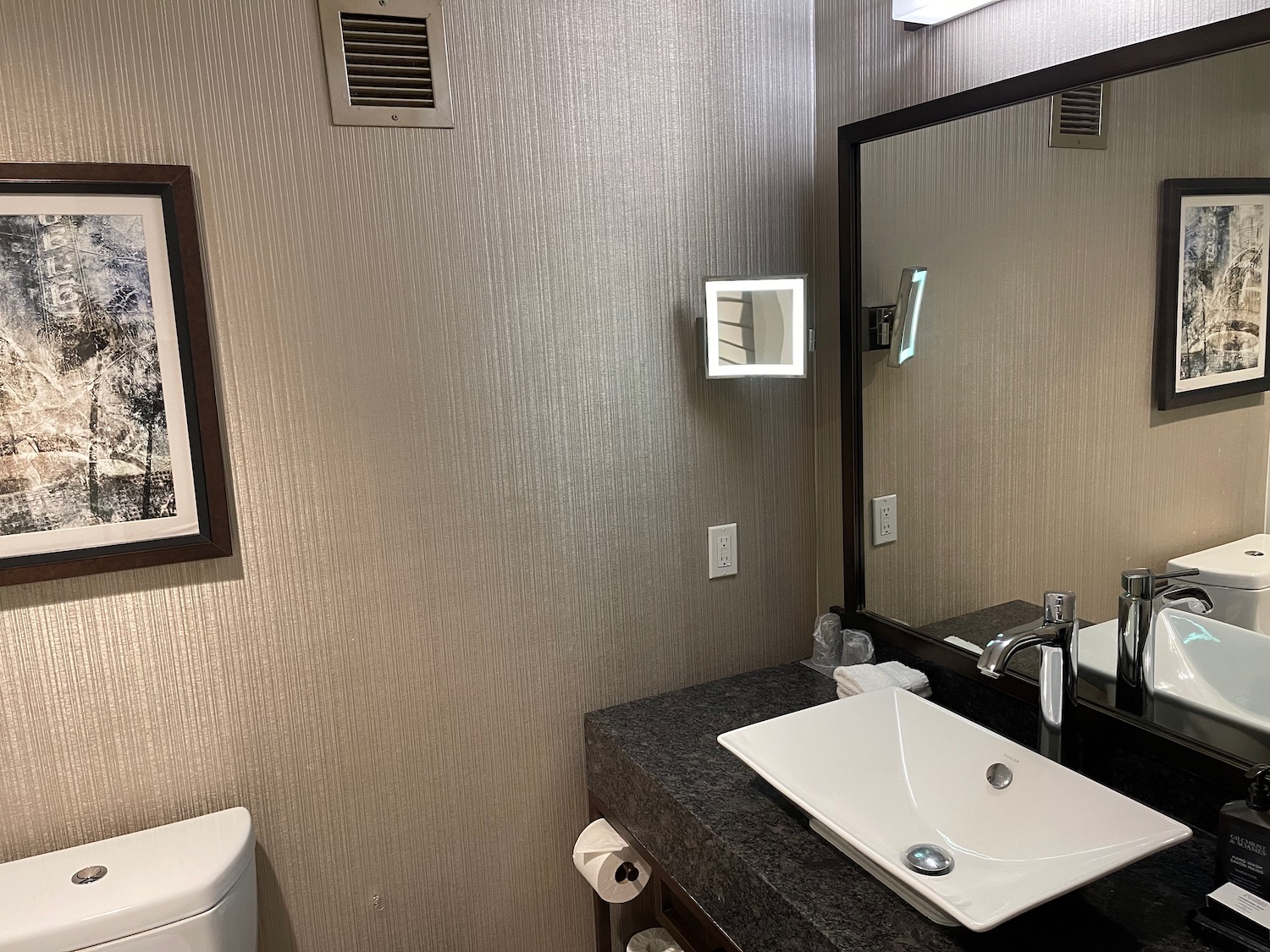 a bathroom with a sink and mirror