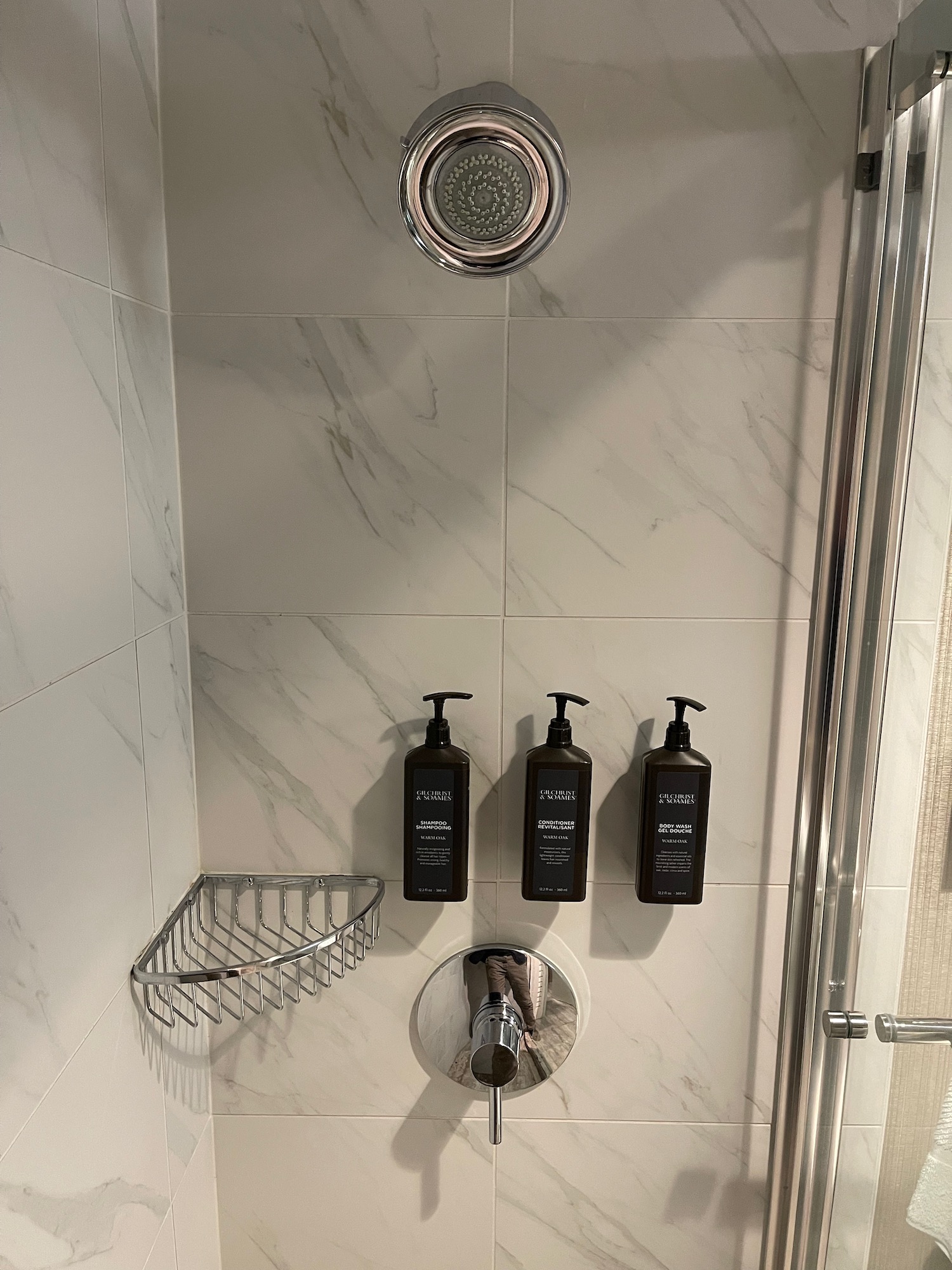 a shower with a shower head and shower head