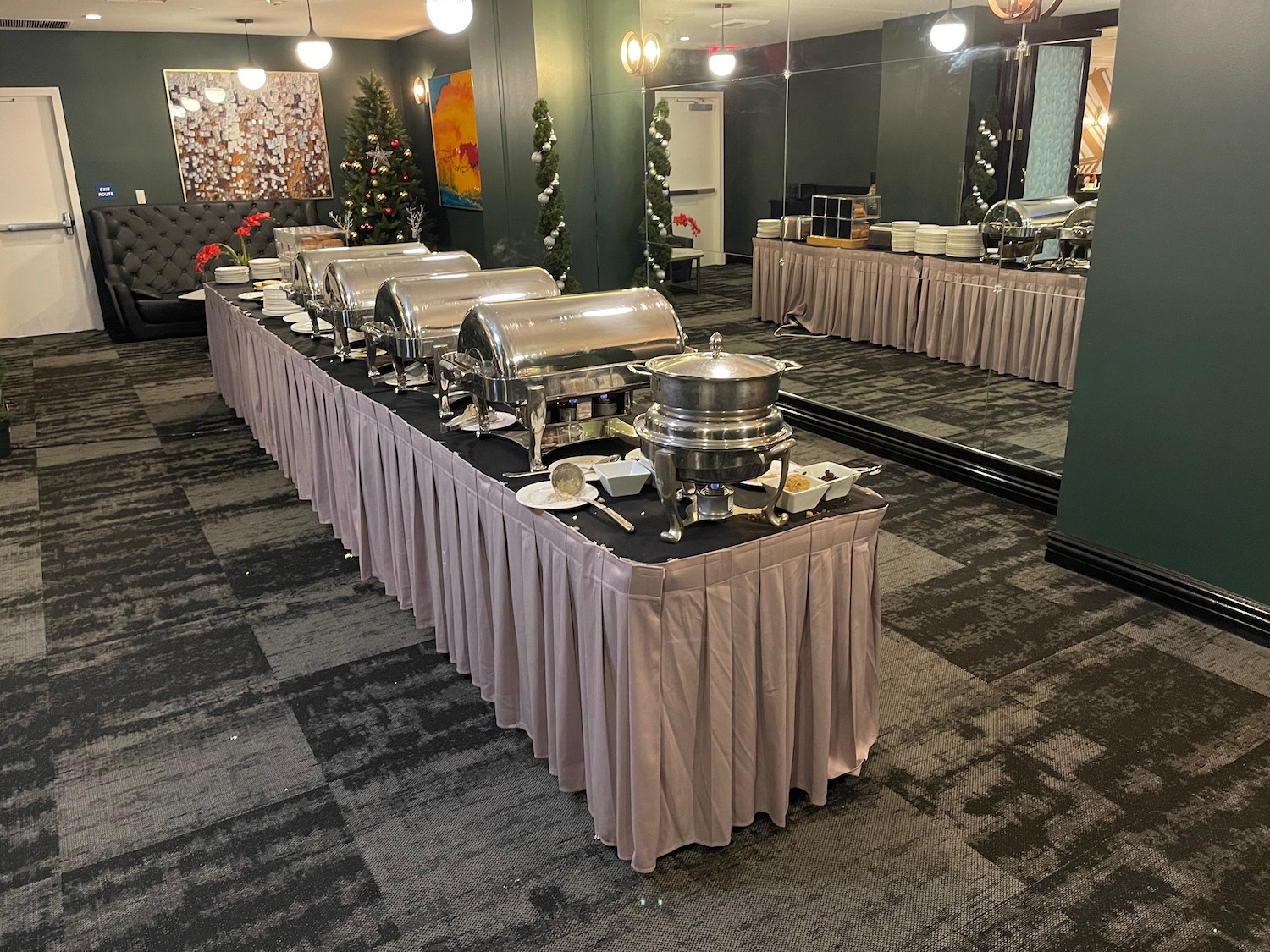 a buffet table with silver containers