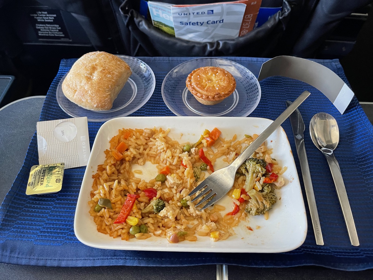 a plate of food and a fork on a tray