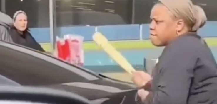 a man holding a baseball bat