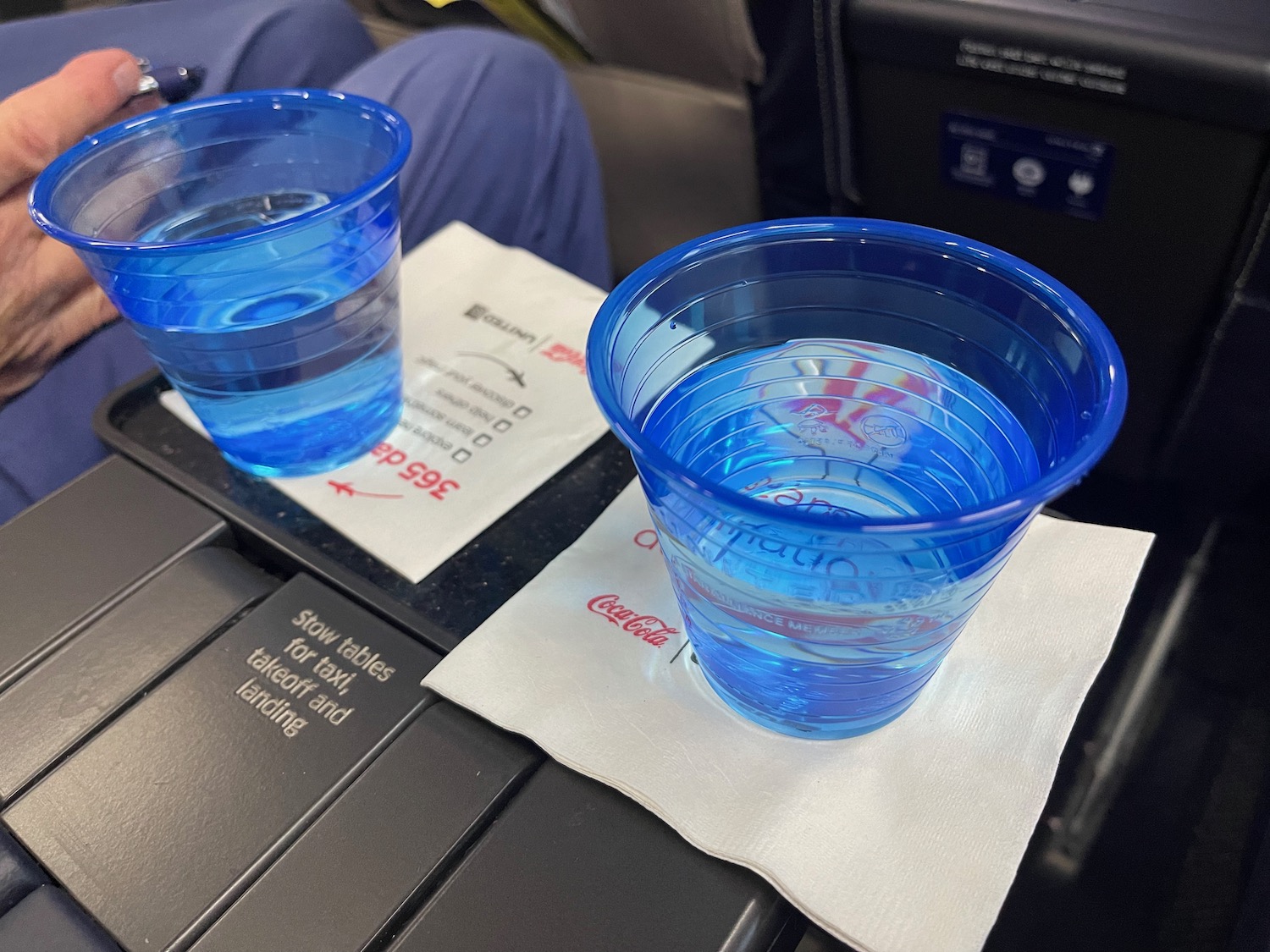 two plastic cups on a table