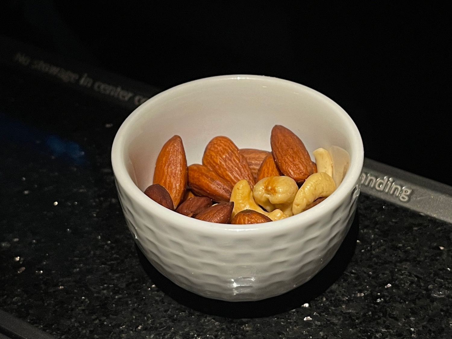 a bowl of nuts on a counter