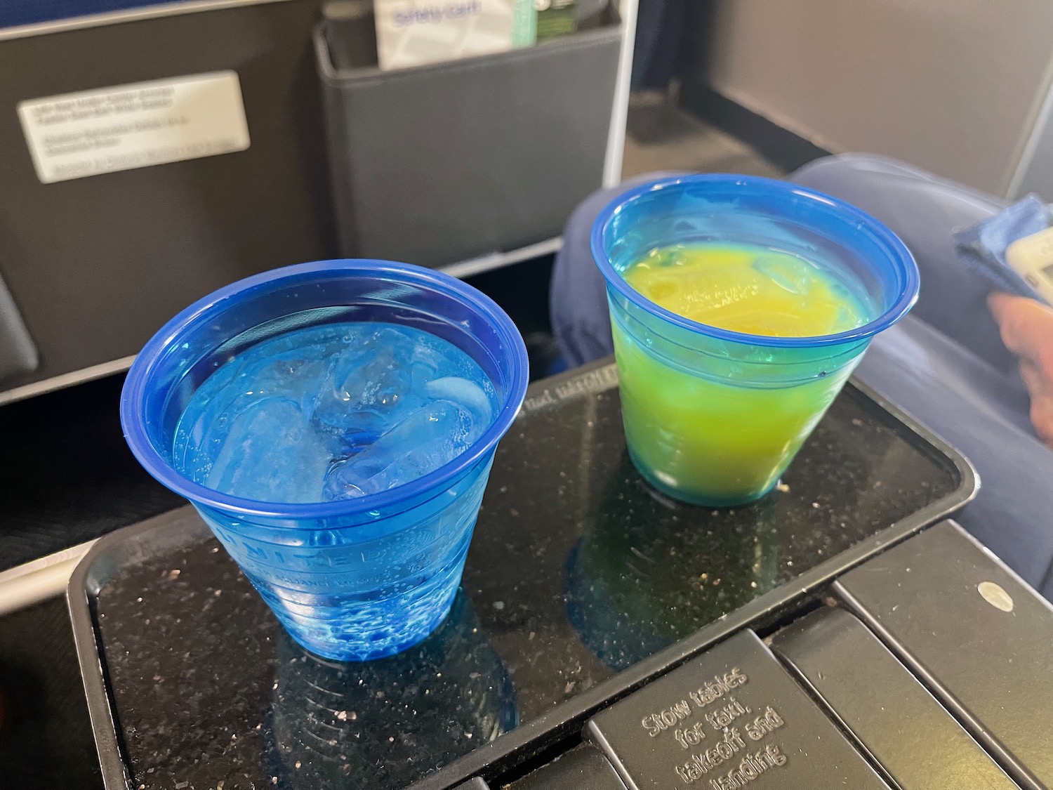 two cups of liquid on a tray